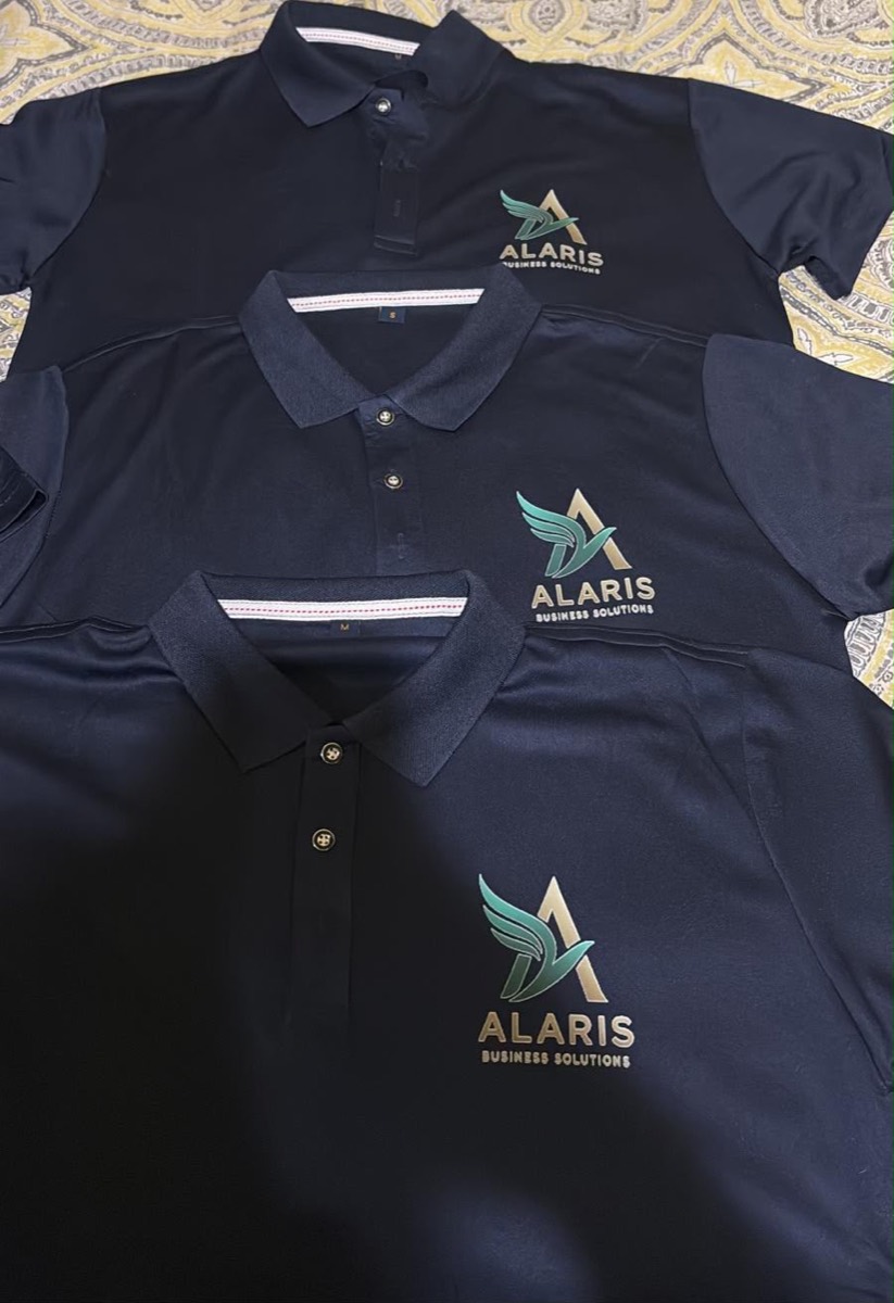 Three navy polos with the Alaris Business Solutions logo