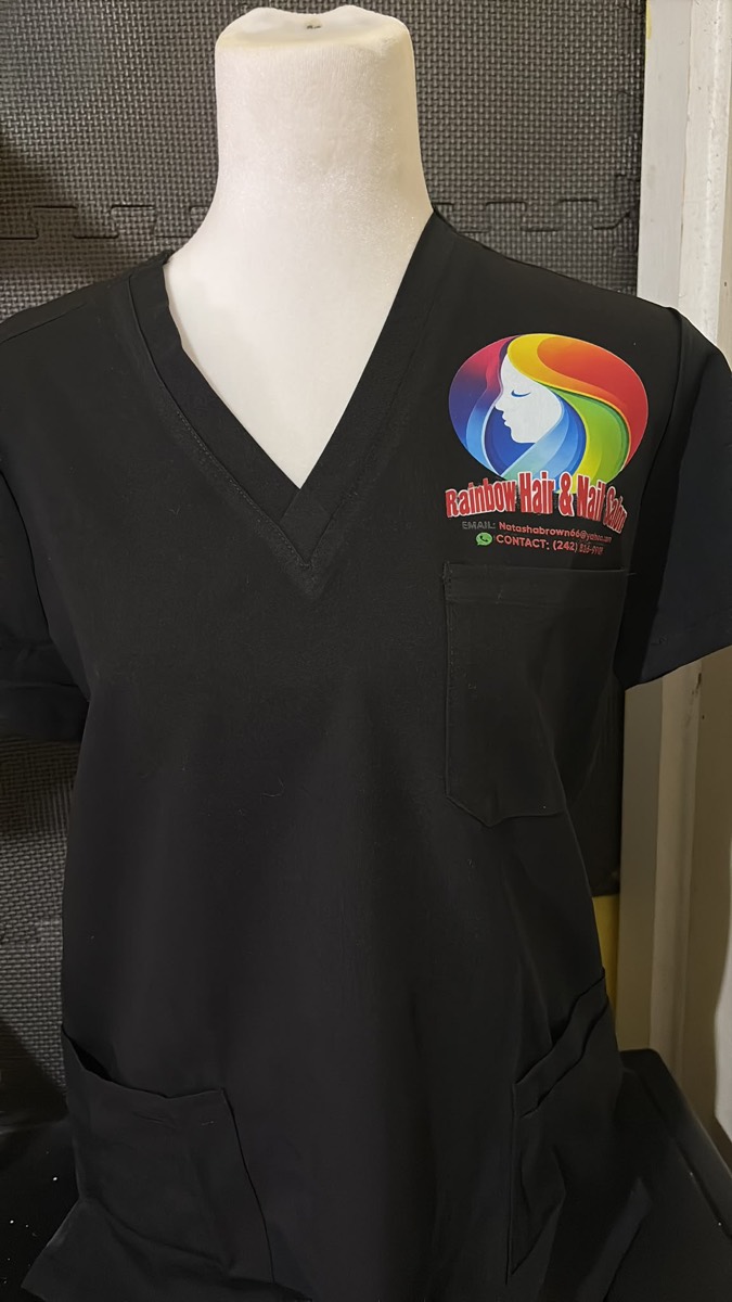 Black scrub top with a rainbow salon logo and contact details