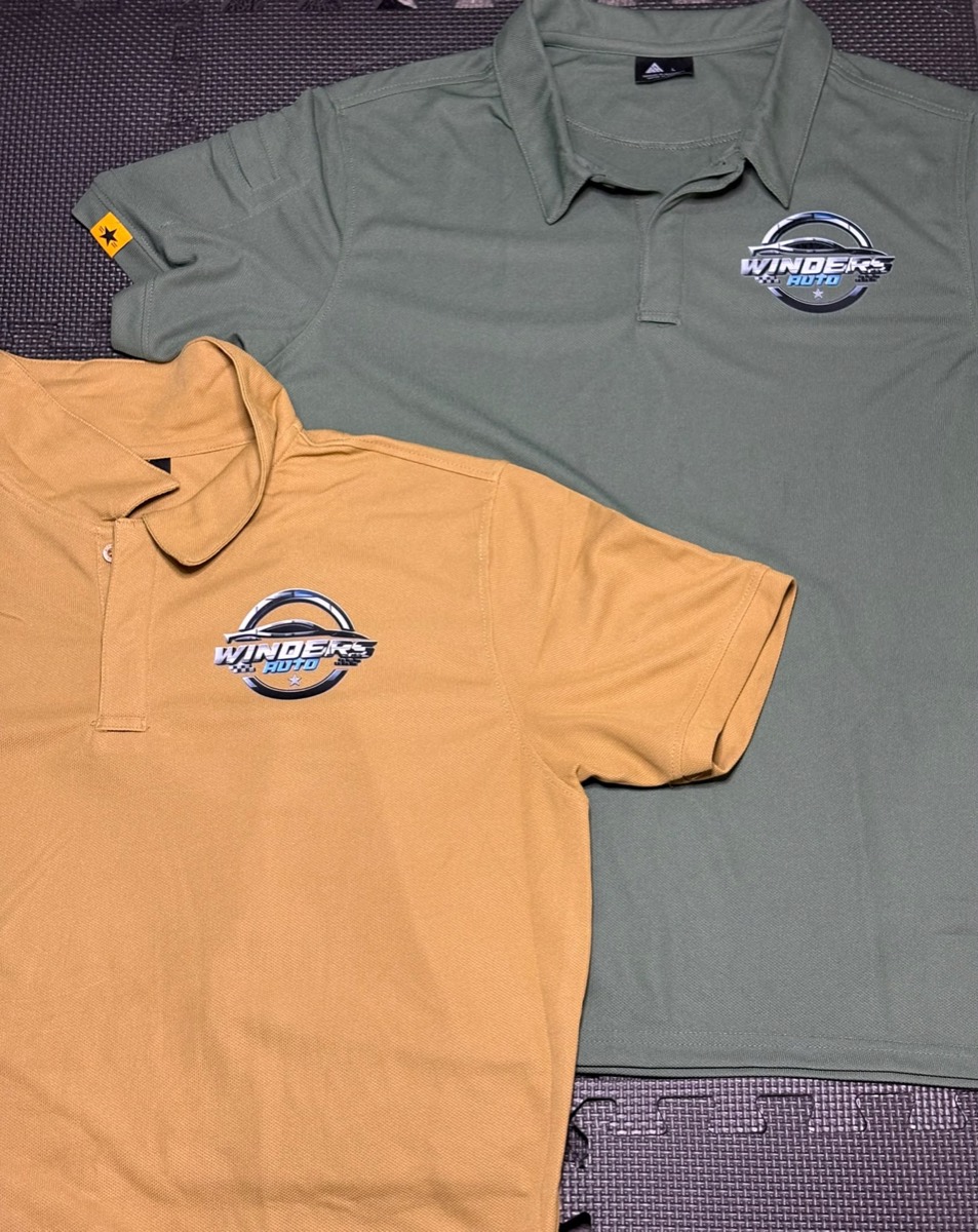 Olive and mustard polos with the Winders Auto crest